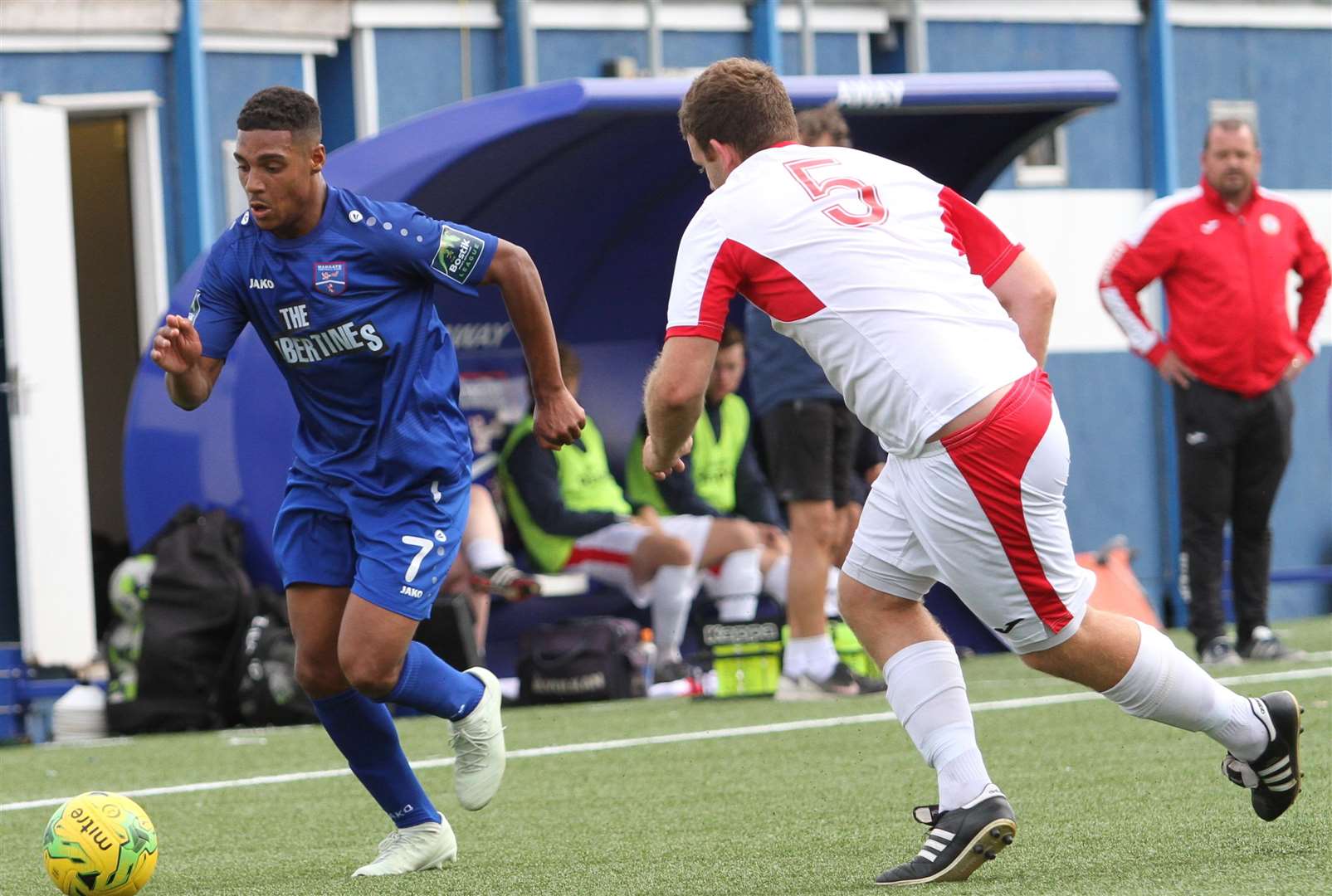 Margate debutant George Brown takes on Horndean defender Dan Sachman Picture: Don Walker