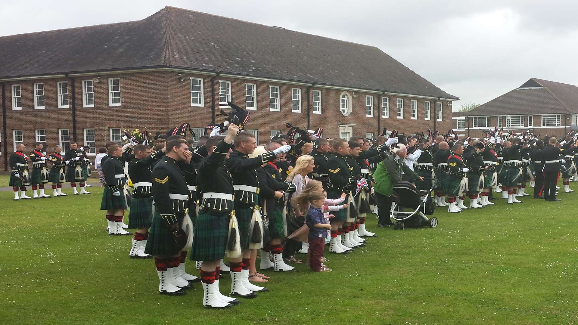 Soldiers wave goodbye to the Queen after Howe Barracks visit