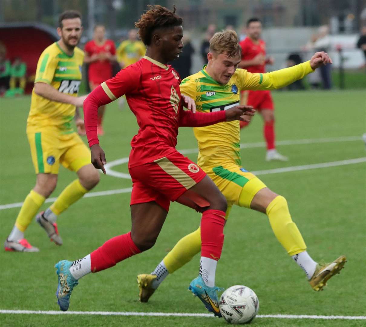 Whitstable's Jayden Silcott-Brown is challenged by Lydd’s Will Dempsey. Picture: Les Biggs