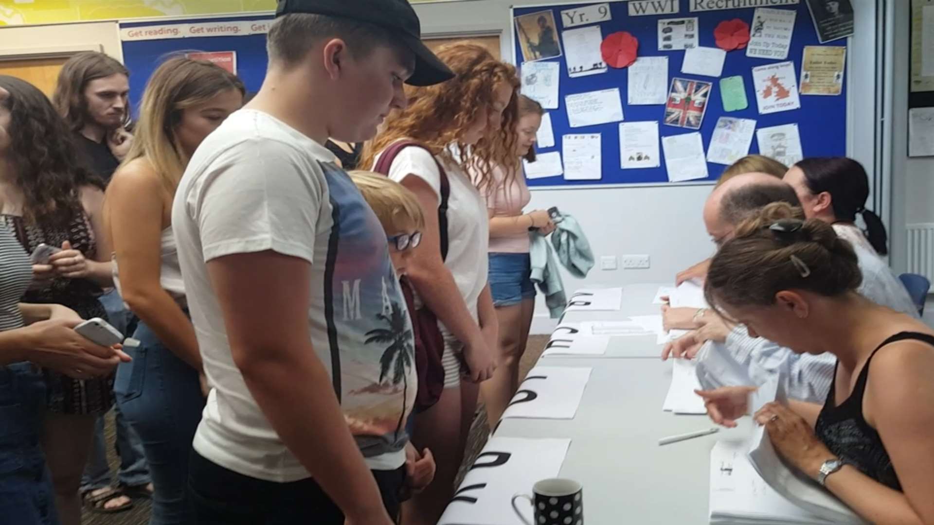 Students wait to receive their GCSE results from staff at Dane Court Grammar School