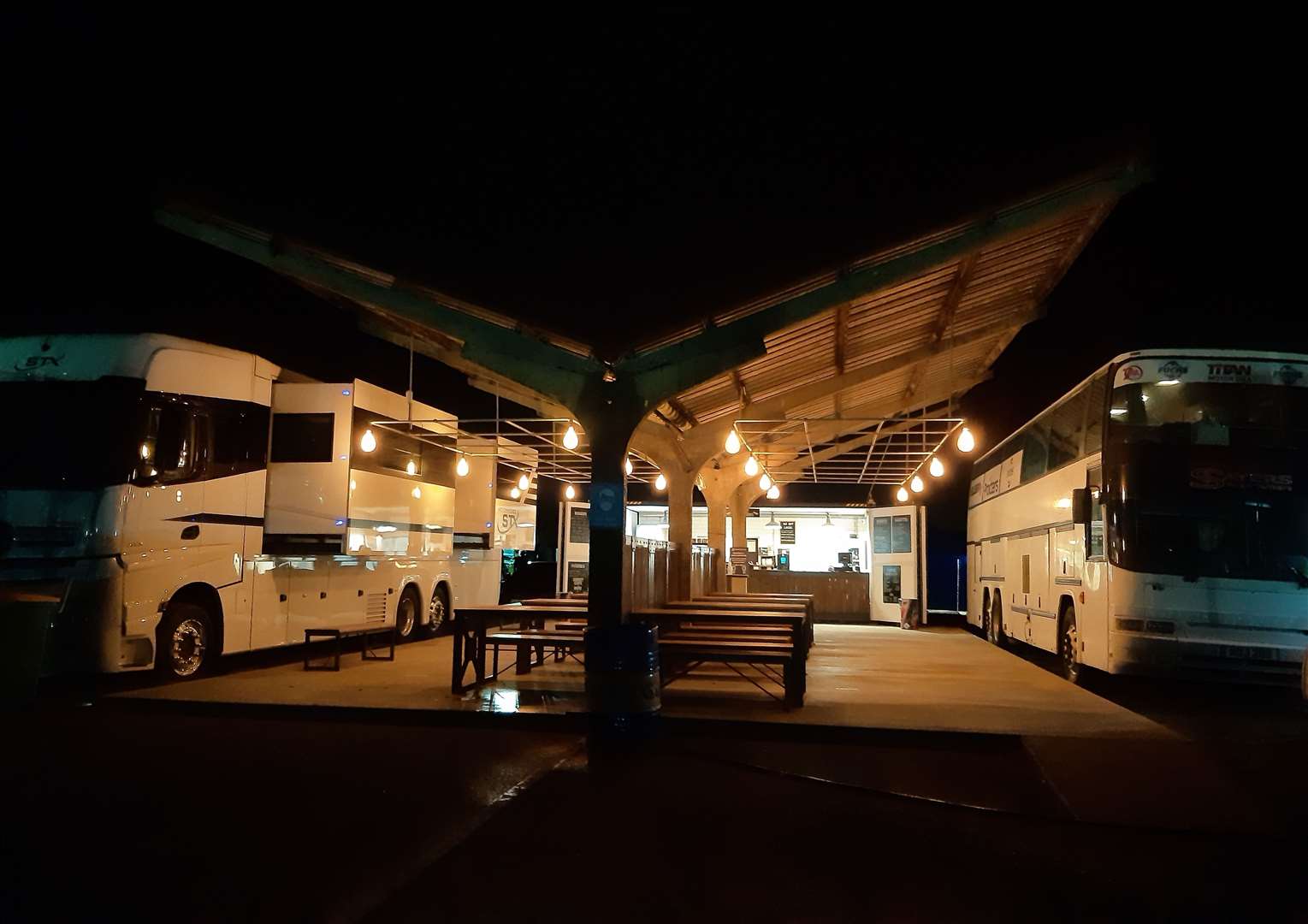 The former scrutineering building - now called the food bay - pictured at night on Saturday evening