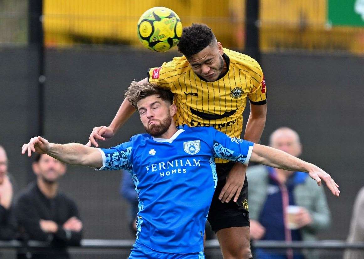 Cray Wanderers defender Quade Taylor outjumps Tonbridge striker Noel Leighton. Picture: Keith Gillard