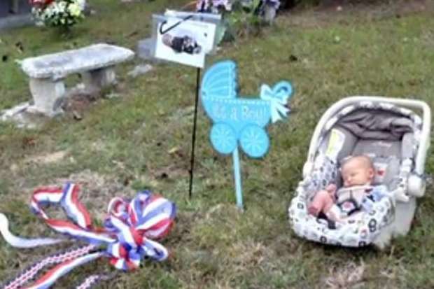 S/Sgt Austin's baby at his grave in America