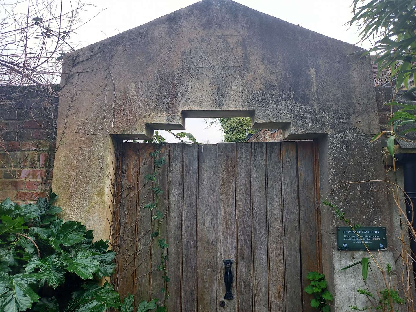 The gated entrance features an engraved Star of David