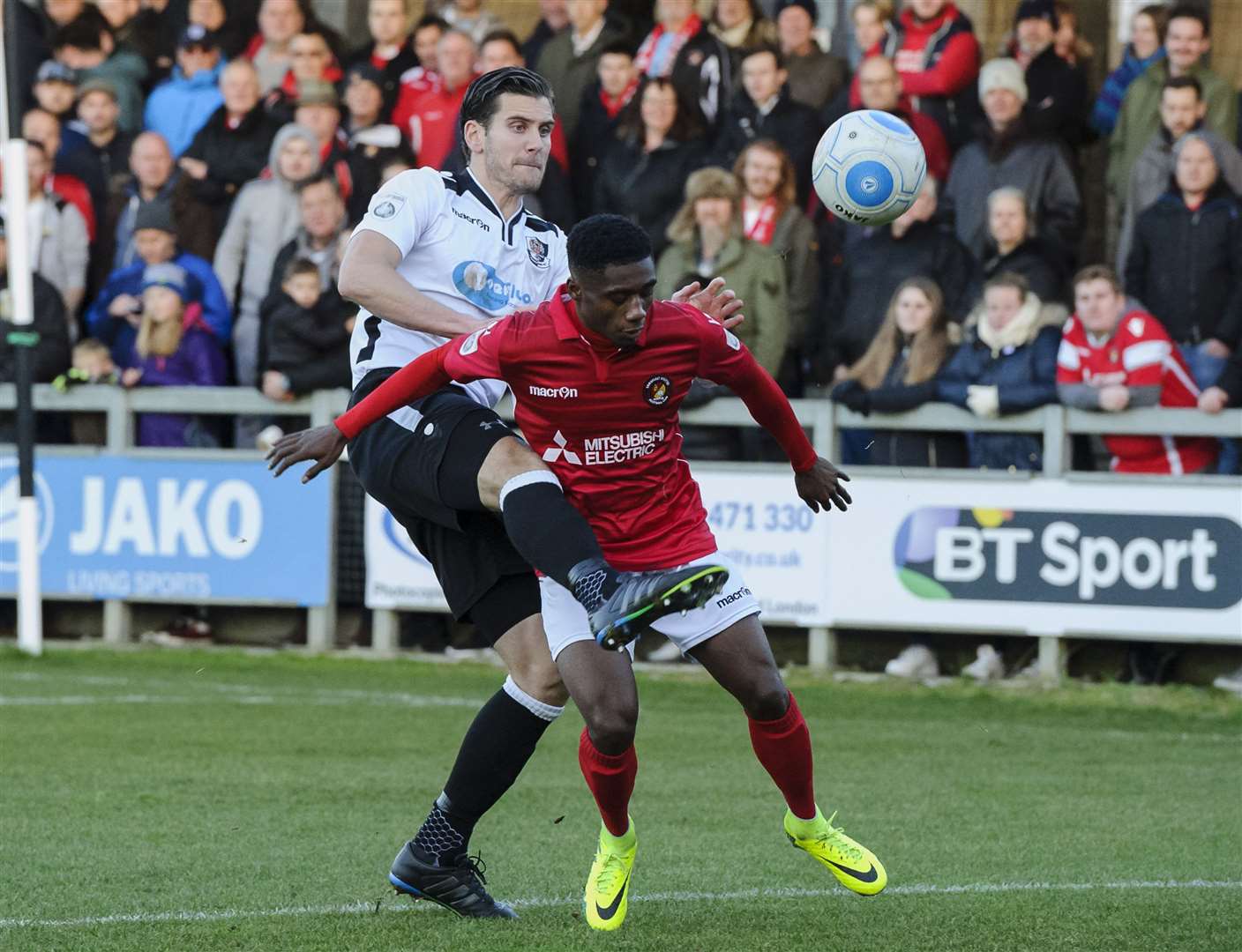 Derby action as Darts centre-back Tom Bonner is up against Ebbsfleet’s Darren McQueen in 2016. Picture: Andy Payton