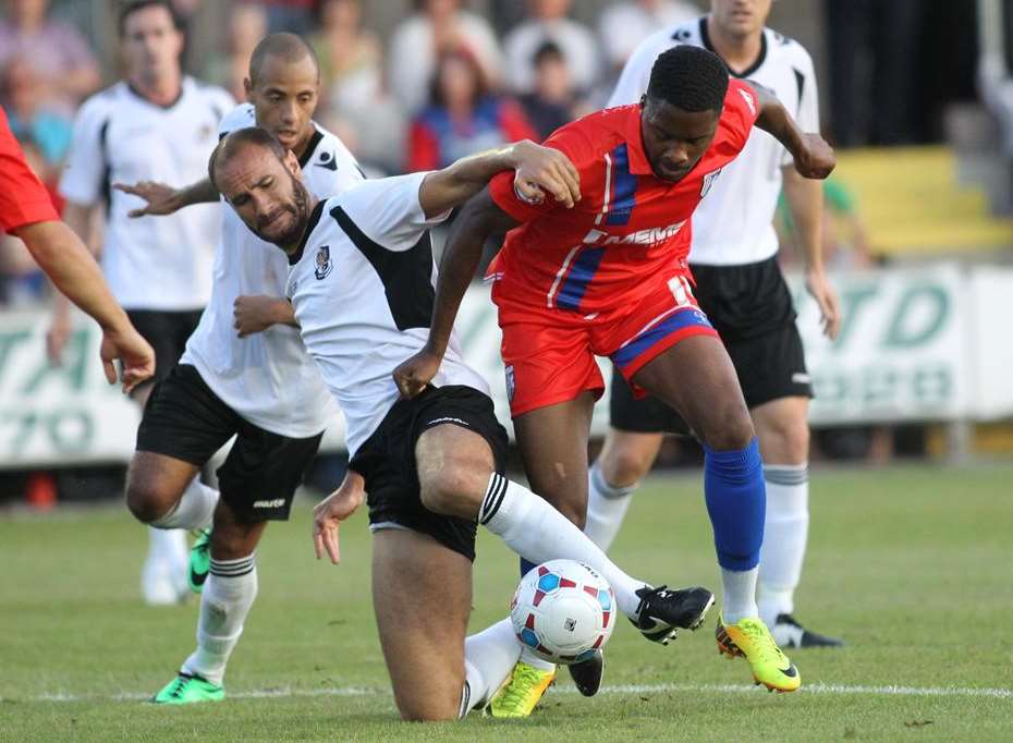 Dartford defender Mat Mitchel-King and Gills striker Antonio German challenge Pic: John Westhrop