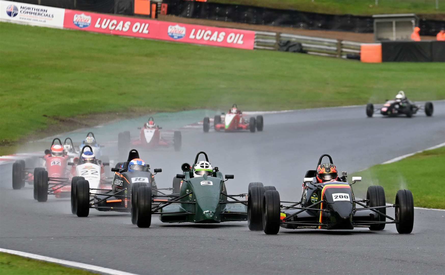 Smith, chased here by Joey Foster and Chris Middlehurst, scored his second Formula Ford Festival victory in his Van Diemen JL13. Picture: Simon Hildrew