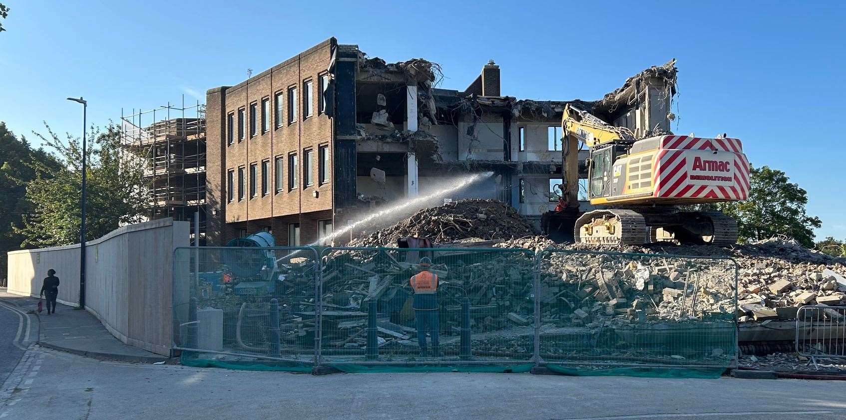 Water being sprayed to damped down the dust as Maidstone's former sorting office is demolished