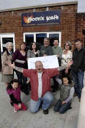 Phil Scott with staff, trustees and members of the Phoenix Community Centre who are celebrating the £350,000 award