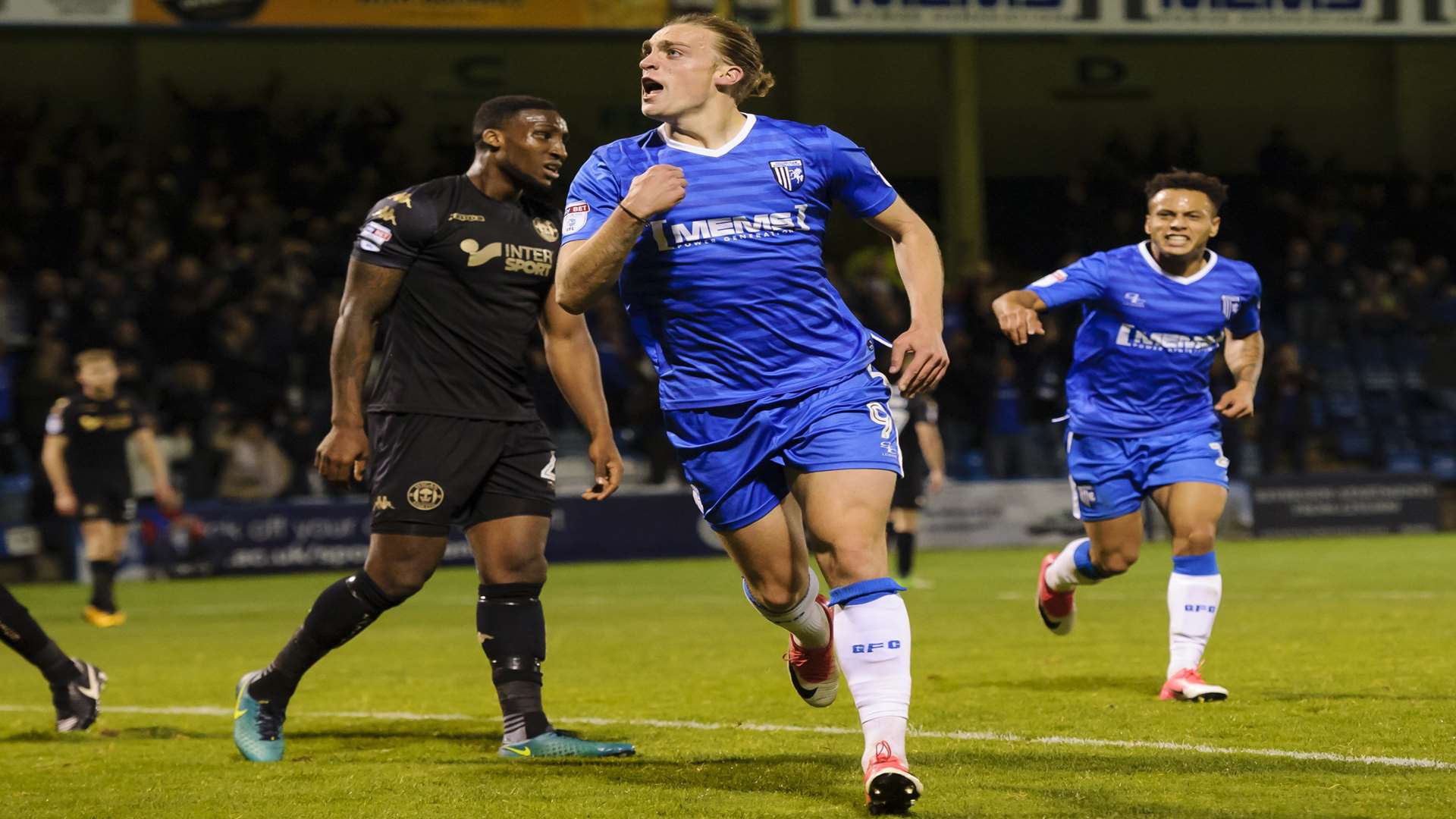 Tom Eaves puts the Gills ahead against Wigan Picture: Andy Payton