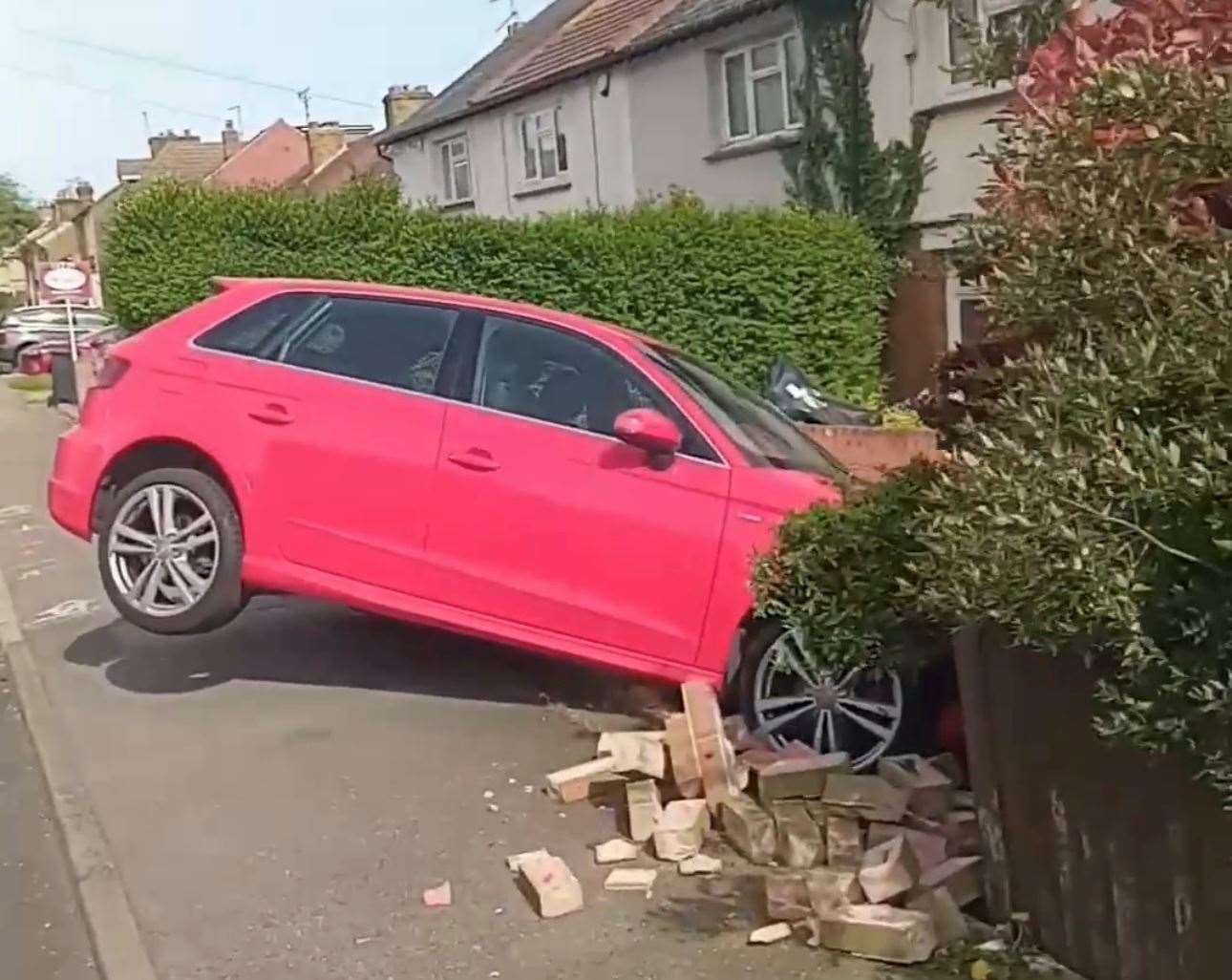 Bricks were sprawled across the pavement and in the property's front garden. Picture: Ilteris Gunay