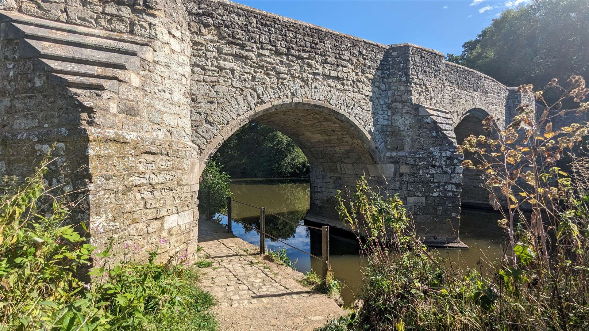 The path passes under the historic Teston Bridge