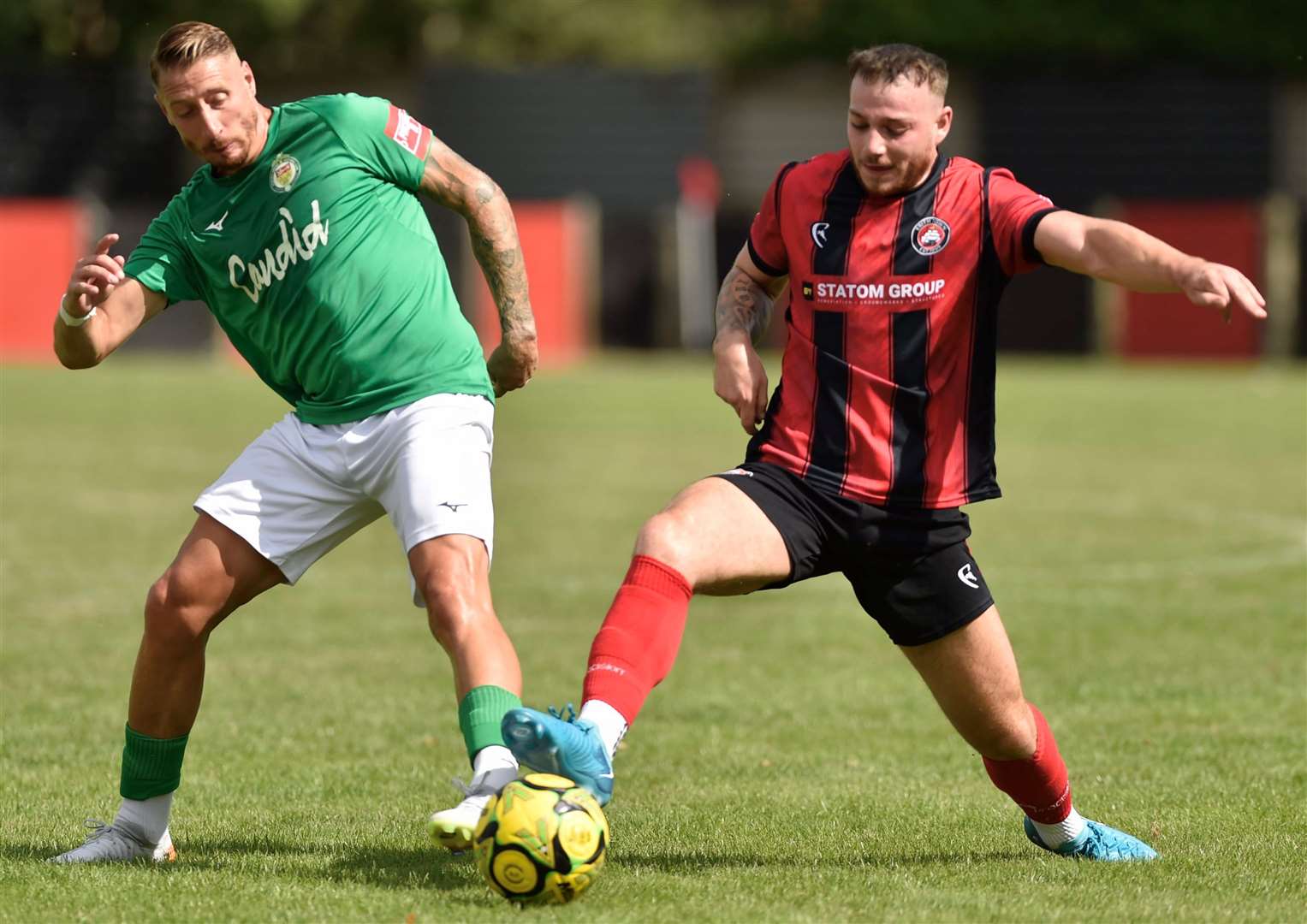 Asfhord’s Lee Martin (left) challenges against Erith Town on Saturday. Picture: Ian Scammell