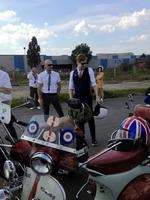 Ricky Wilson of the Kaiser Chiefs admires the scooters at rehearsals in Dagenham