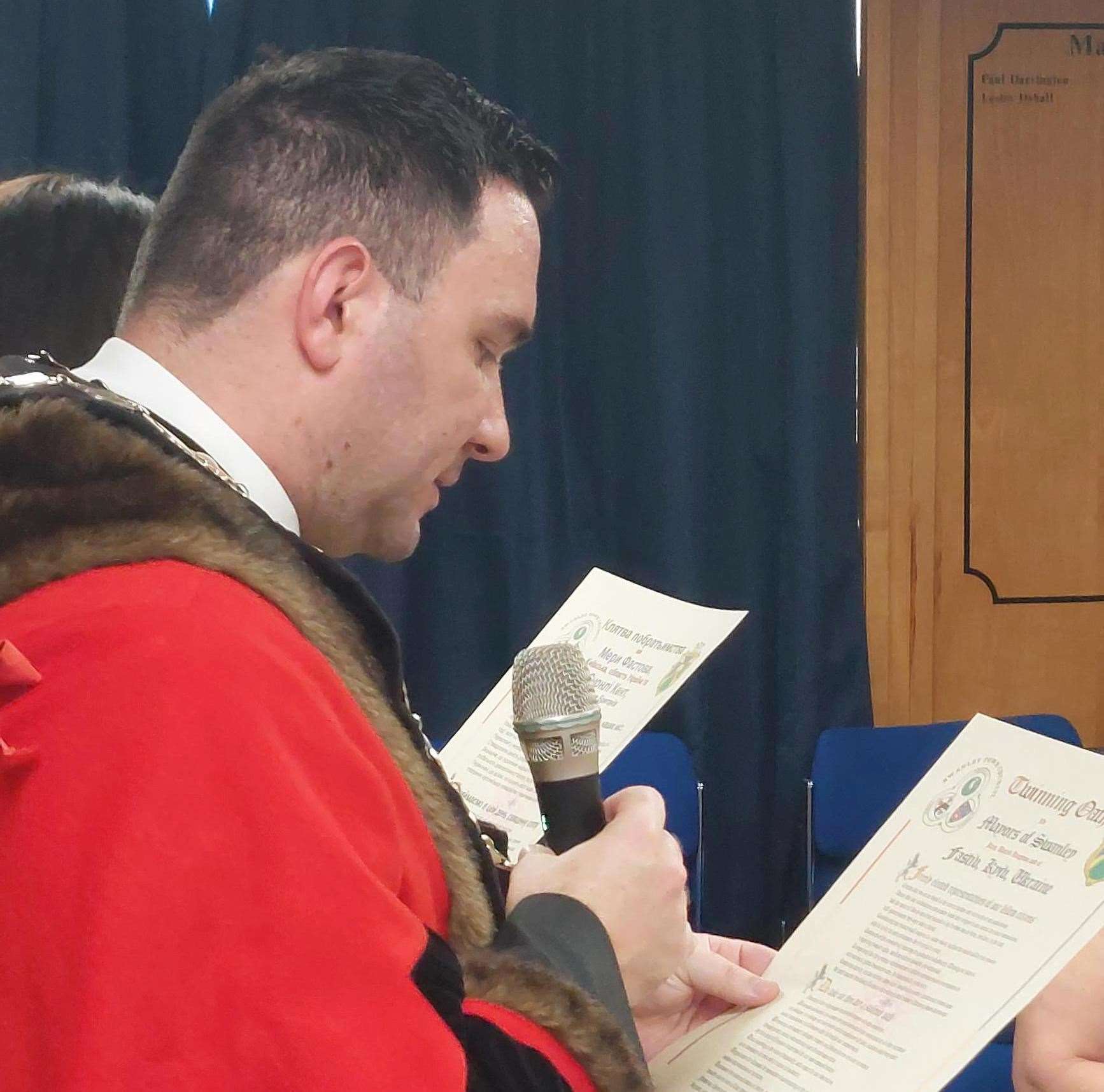 Swanley Mayor Cllr Michael Horwood reading the oath with the translator