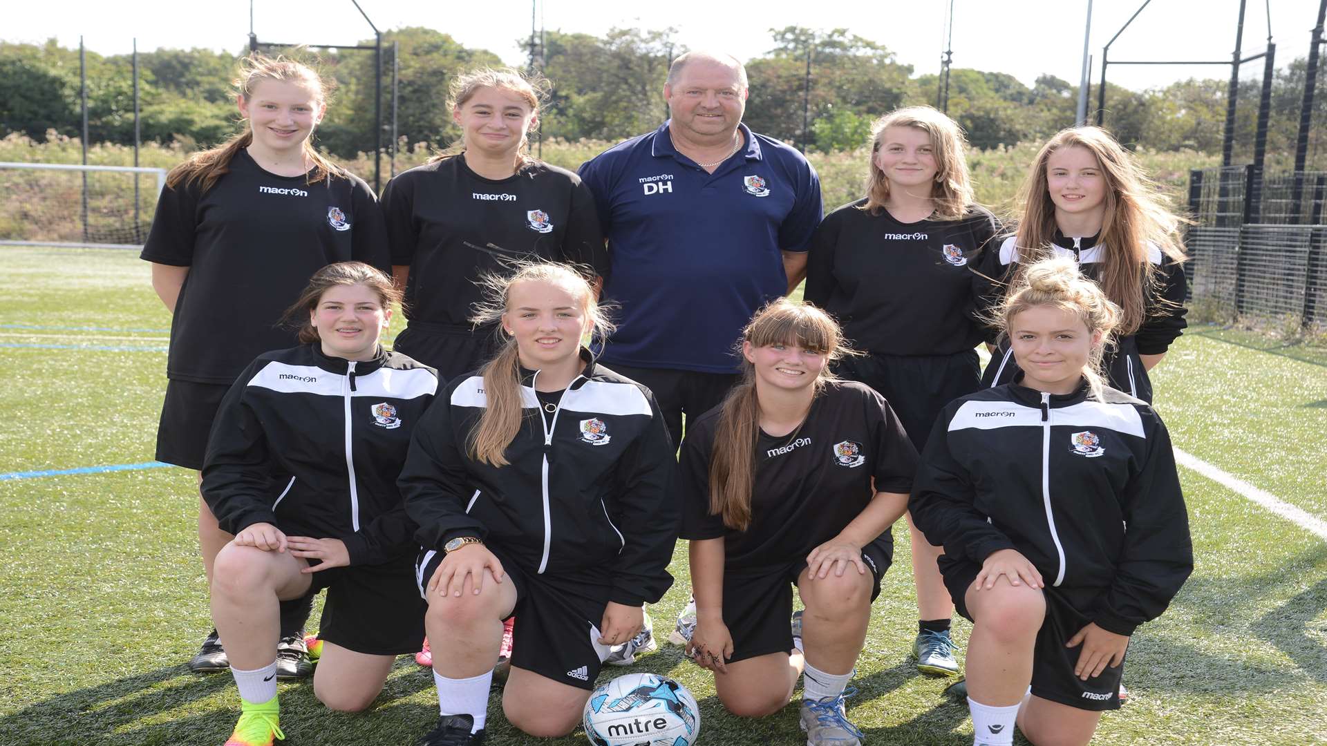 Front Honey Miller, Ellie Haynes, Michaela Hill, Brittani Rumble Back Masie Challis, Lizzie Waldie, Coach - Dave Hill, Amy Jarman, Shania Cogger Senior Girls Football team from Leigh Academy training at Dartford FC stadium