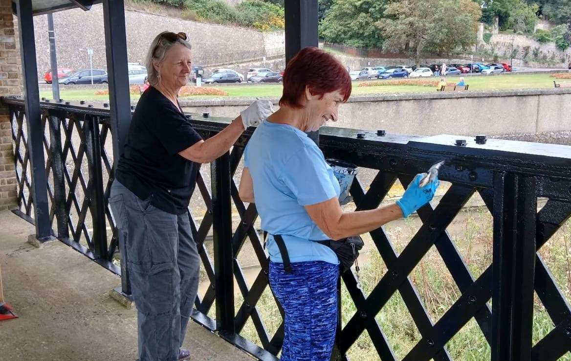 Volunteers givee the historic pier a lick of paint