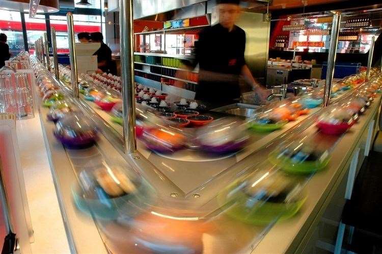 The popular restaurant chain offers Japanese food on a conveyor belt (10181435)