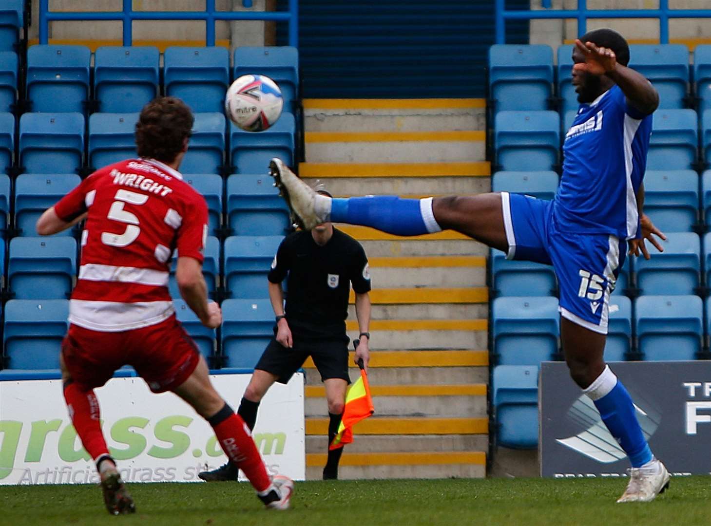 Gillingham forward John Akinde gets ahead of Doncaster's Joe Wright. Picture: Andy Jones (45336100)