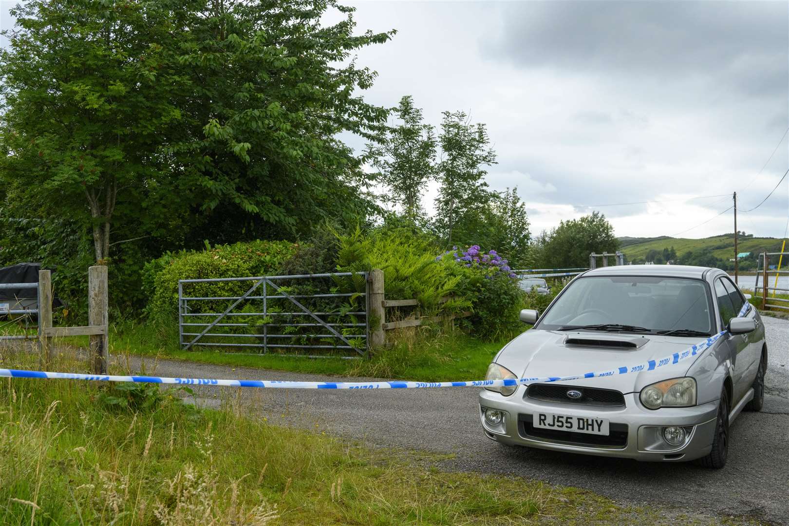 Police investigating the scene of the shooting in Dornie, Wester Ross (John Linton/PA)