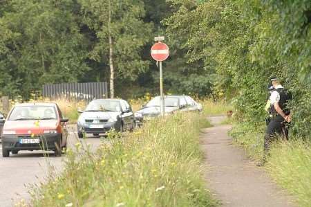 Police near the scene where the body was discovered. Picture: GARY BROWNE