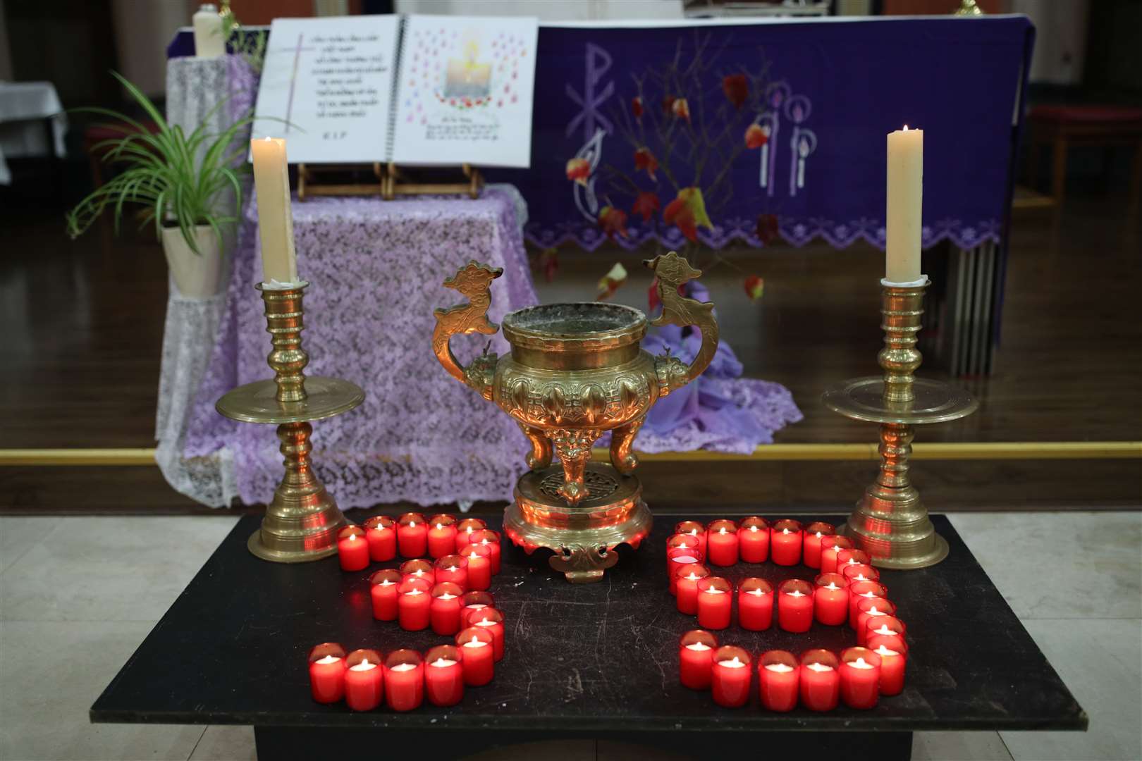 Candles laid out at a vigil for the 39 victims (Yui Mok/PA)