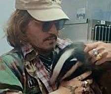 Johnny Depp with a badger on his visit to the centre in 2022. Picture: Folly's Wildlife Rescue