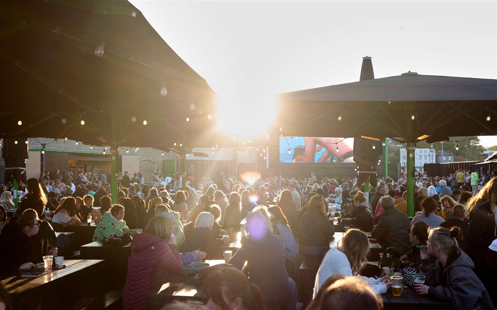 Crowds enjoying the Harbour Screen outdoor cinema on Folkestone Harbour Arm in summer 2023 at The Goods Yard. Picture: Folkestone Harbour