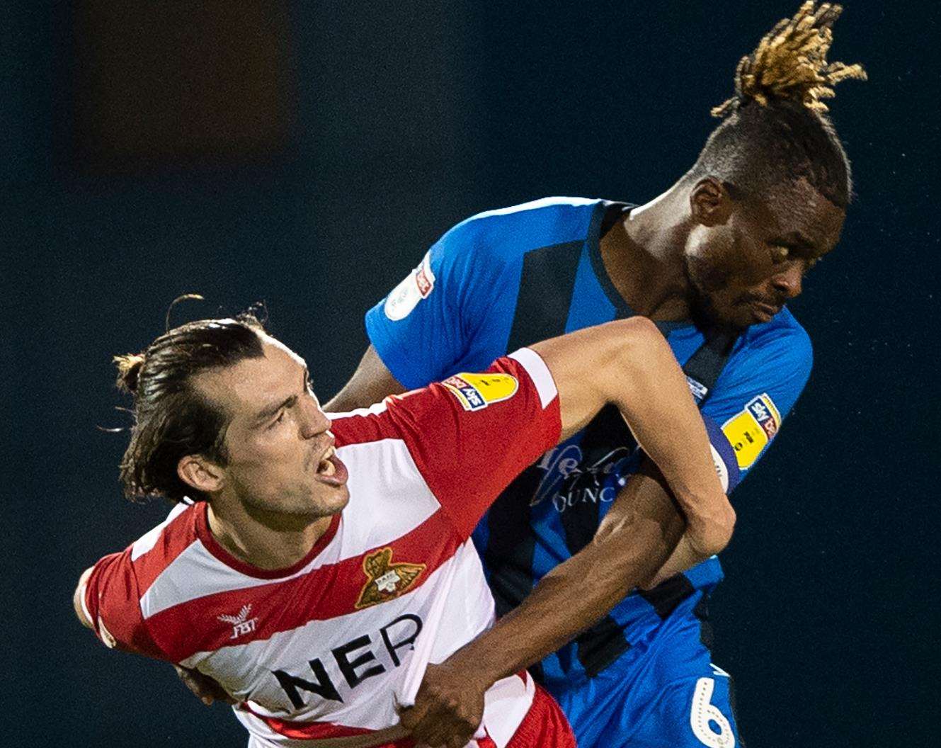 Gabriel Zakuani challenges with John Marquis Picture: Ady Kerry