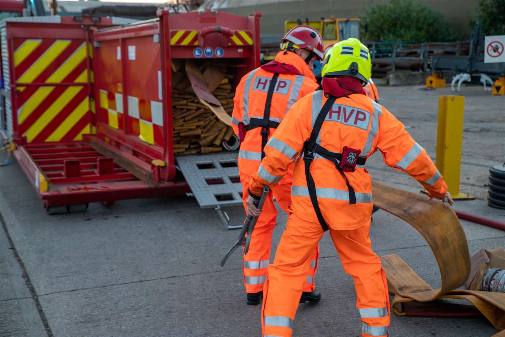 Rolling up the emergency hose from the Sheppey Crossing which topped up the Island's fire engines. Picture: KFRS