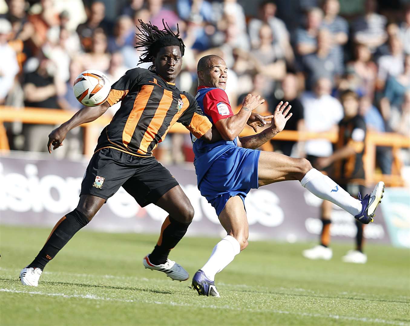 Clovis Kamdjo keeps tabs on Gills' Deon Burton during his Football League days at Barnet Picture: Barry Goodwin