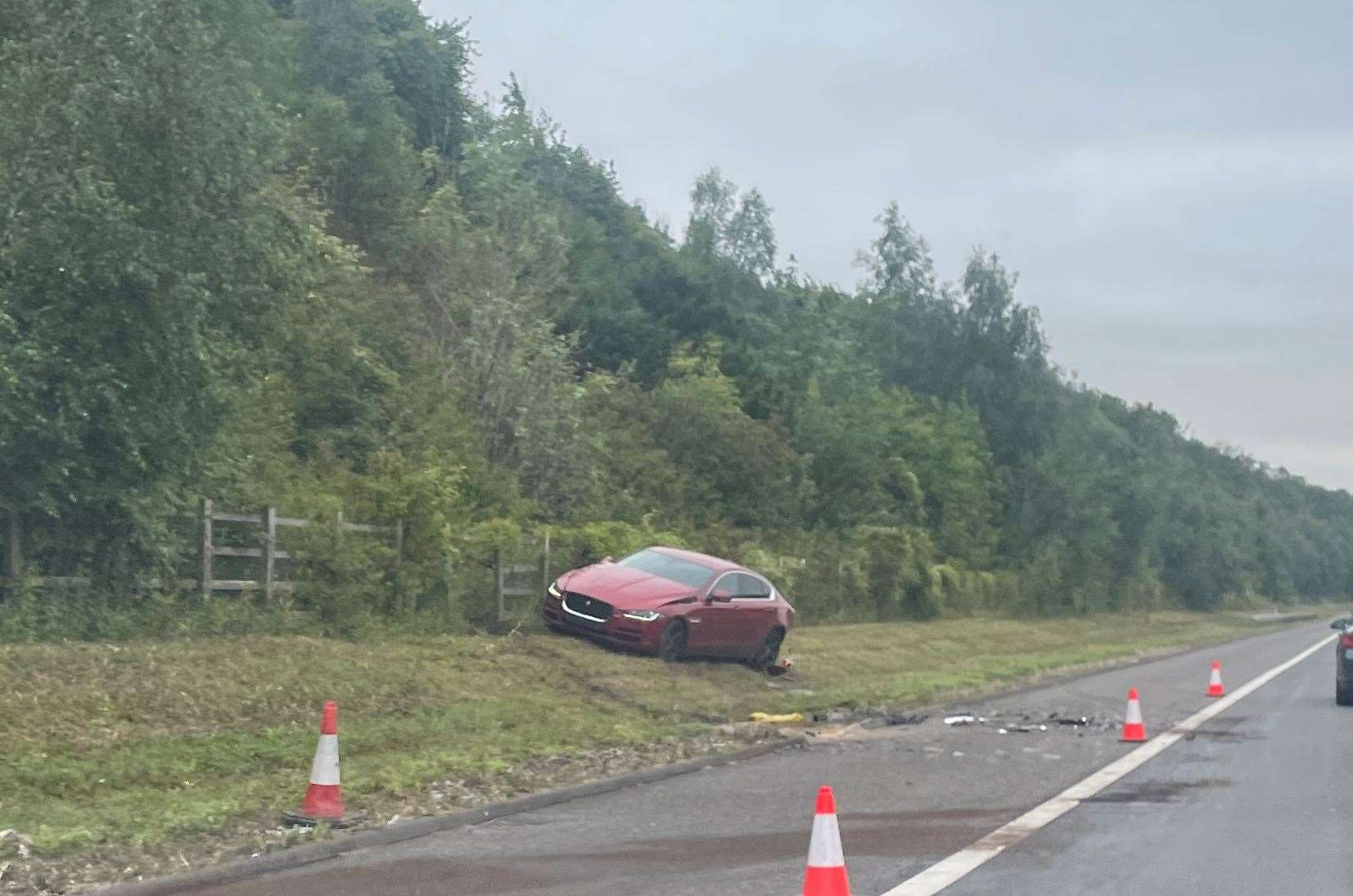 A red car was pictured on a verge on the M2, causing delays for motorists as the situation was dealt with.