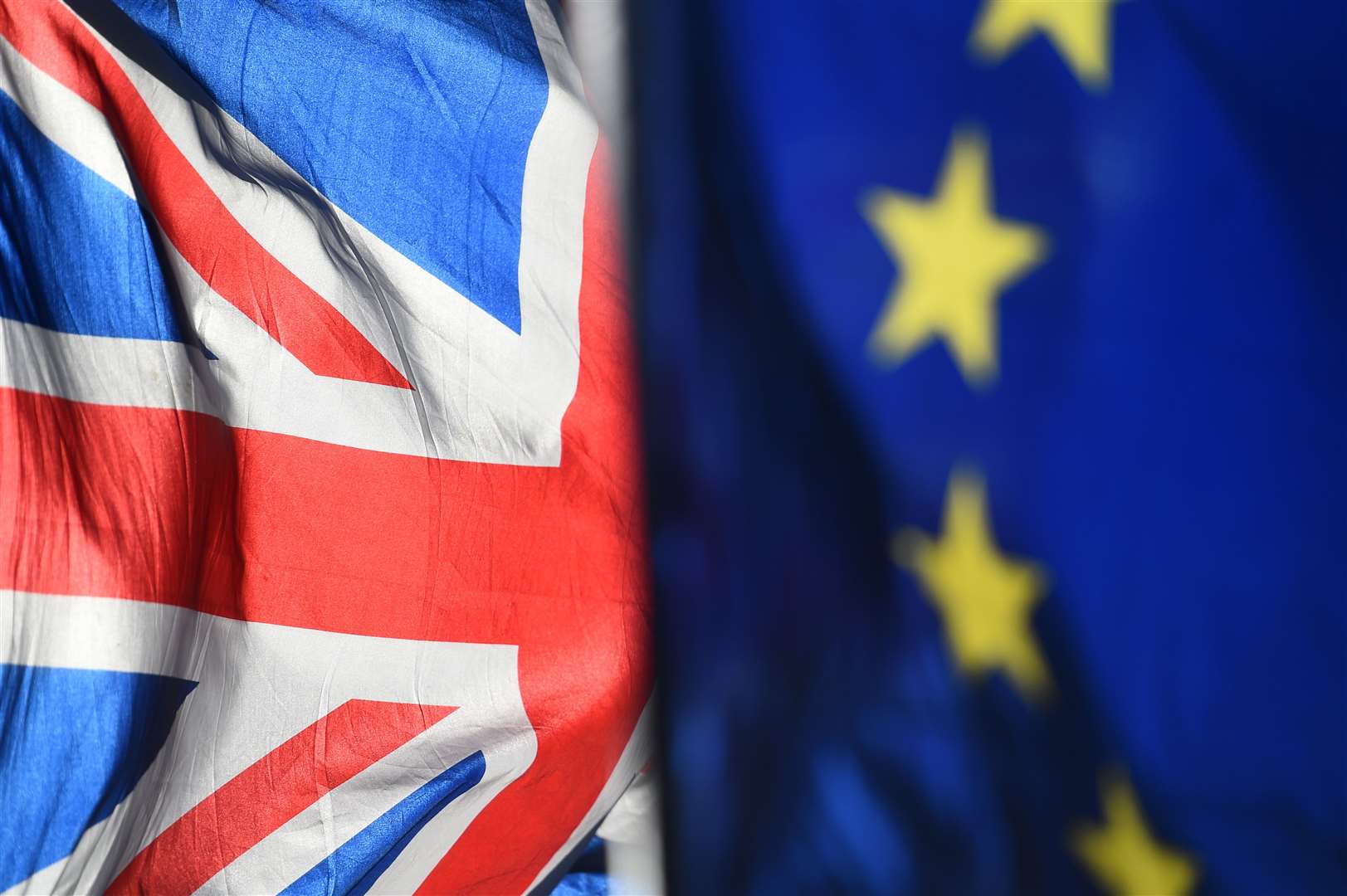 File photo dated 28/01/19 of Union and European Union flags outside the Houses of Parliament, London. Theresa May has warned MPs that if they fail to back her Brexit deal at the third time of asking then Brussels might insist on a lengthy delay, potentially scuppering chances of leaving the European Union altogether.. (44878405)