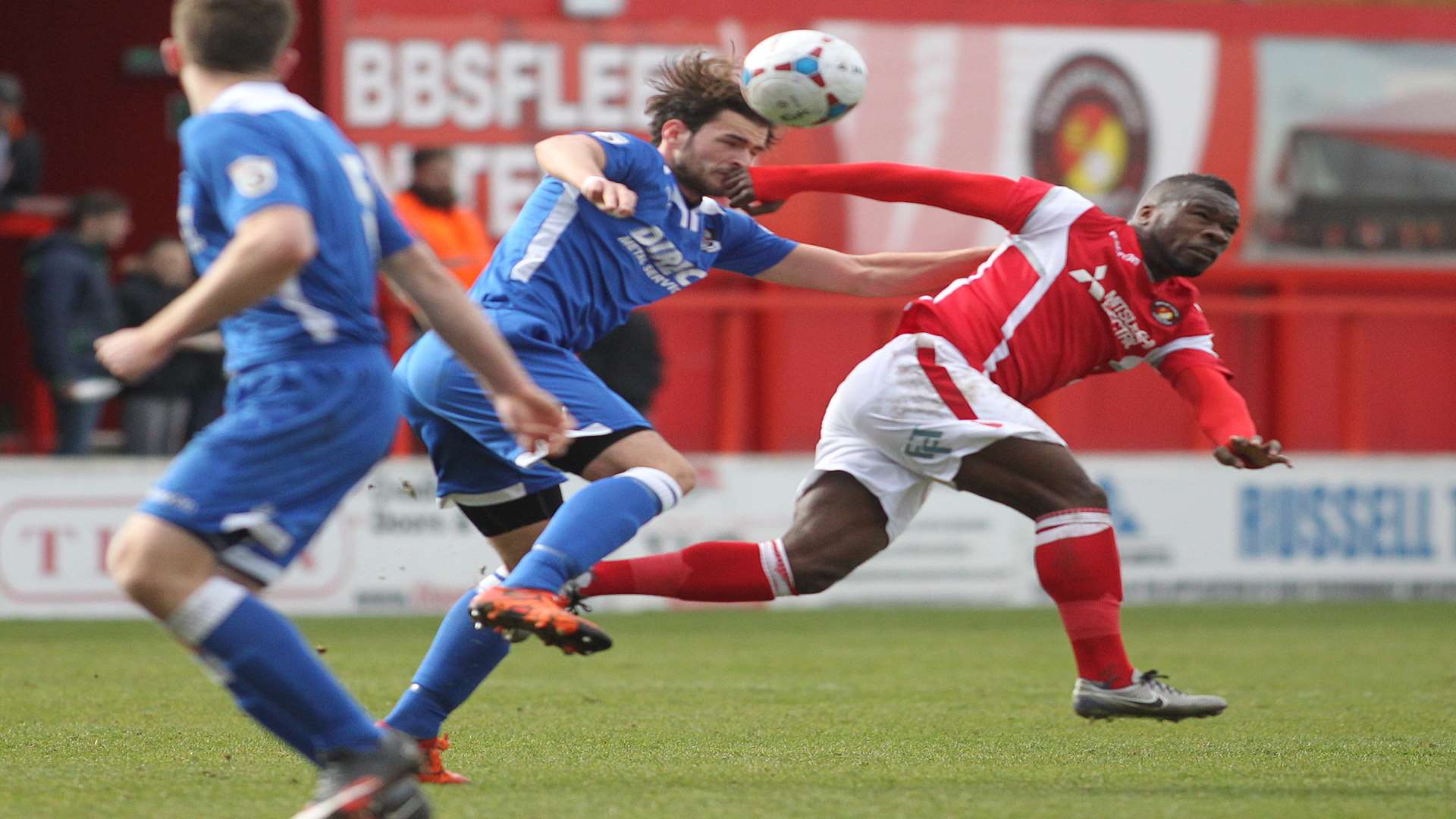 Dartford's Ronnie Vint gets to the ball ahead of Aaron McLean Picture: John Westhrop