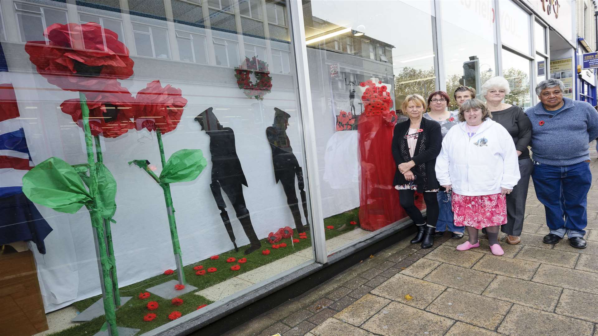 Manager Kim West with other volunteers outside the shop in Strood High Street.