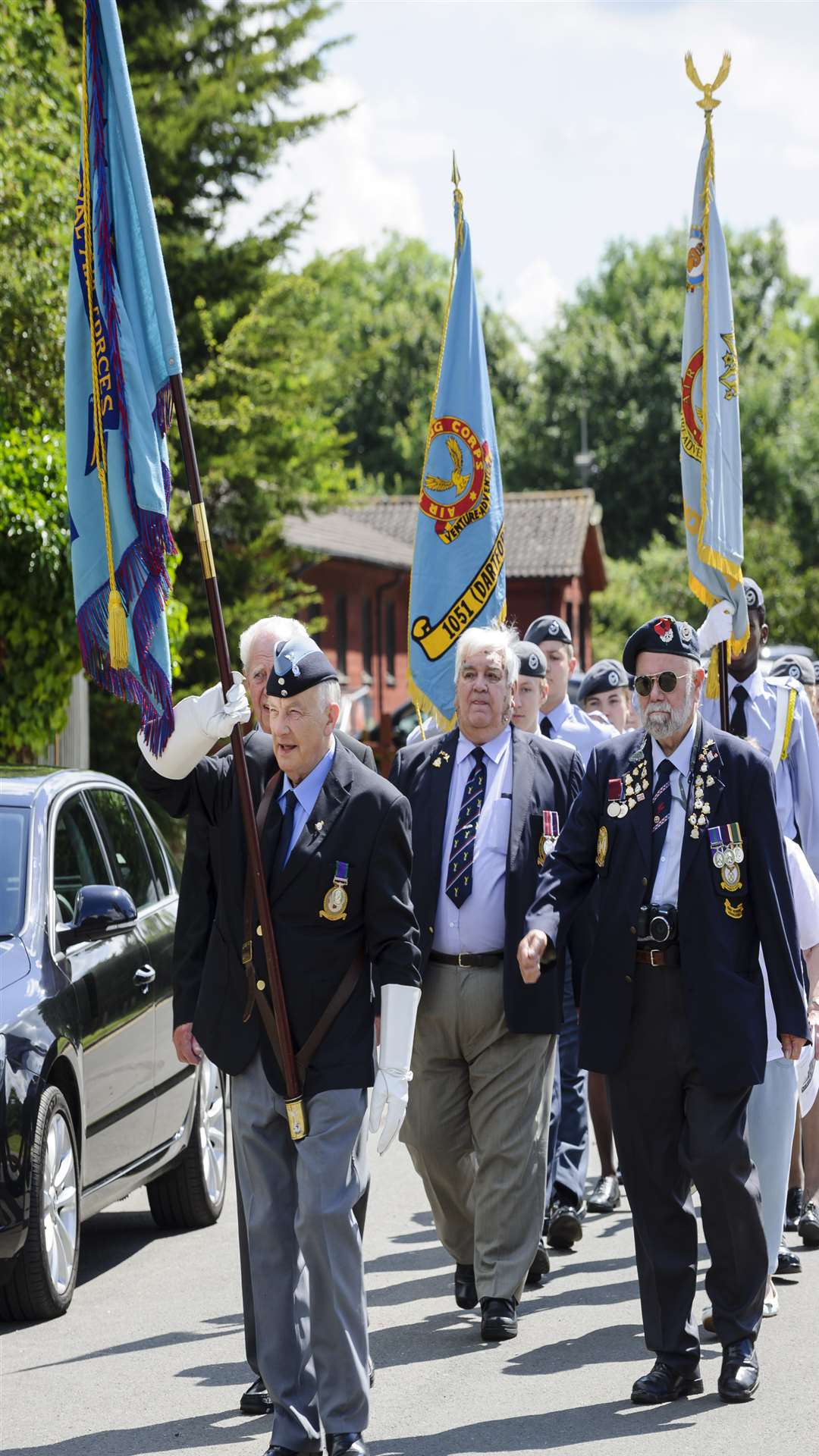 RAF Association standard bearers, veterans and the cadets of 402 Gravesend Sqn and 1051 Dartford Sqn, Air Training Corps, march up to the ceremony