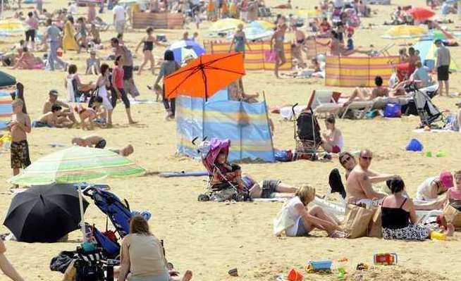 People enjoying the sun on Margate beach in June...by July the weather was much more hit-and-miss