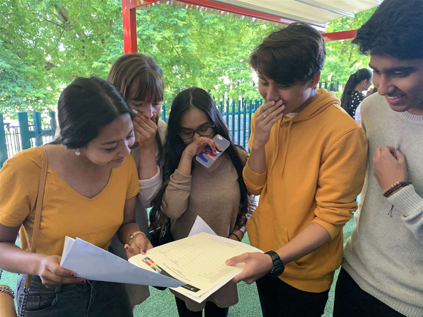 St John Fisher Catholic School pupils, including Marcus Hernandez in the yellow top, looking at their results (15600428)