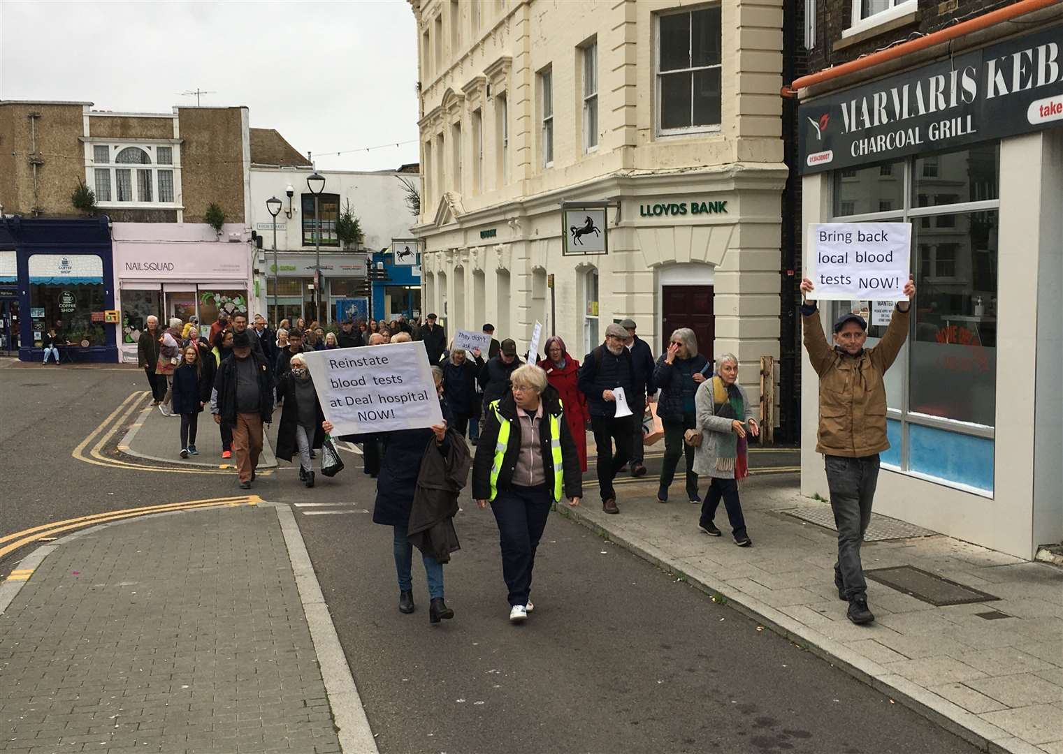 They marched through the town holding banners