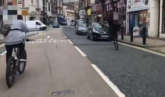 Boys swerving in front of traffic in High Street, Chatham