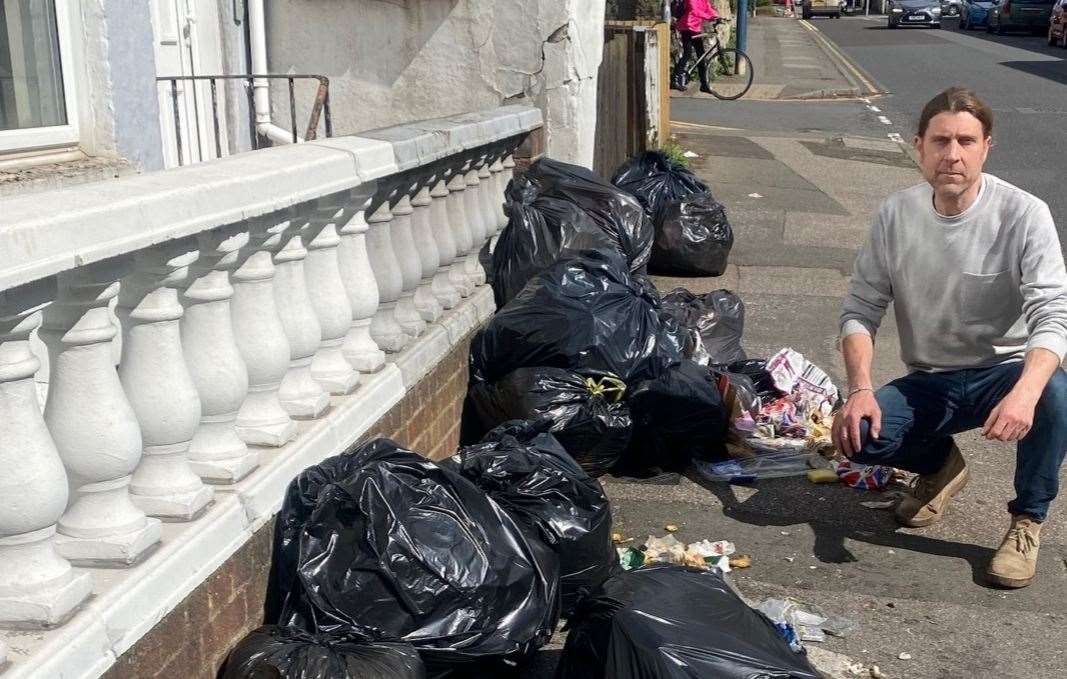 Cllr Tony Harwood with the mess caused by the overflowing black sacks in Lower Boxley Raod