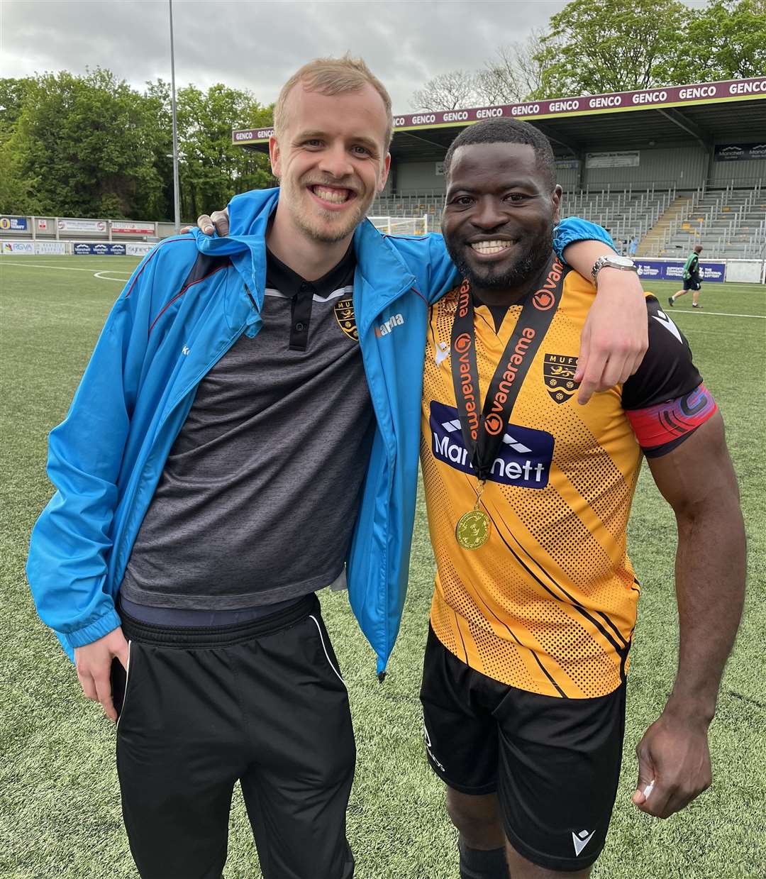 Ben Austen, pictured with former Maidstone captain George Elokobi, is a volunteer in the club's media team