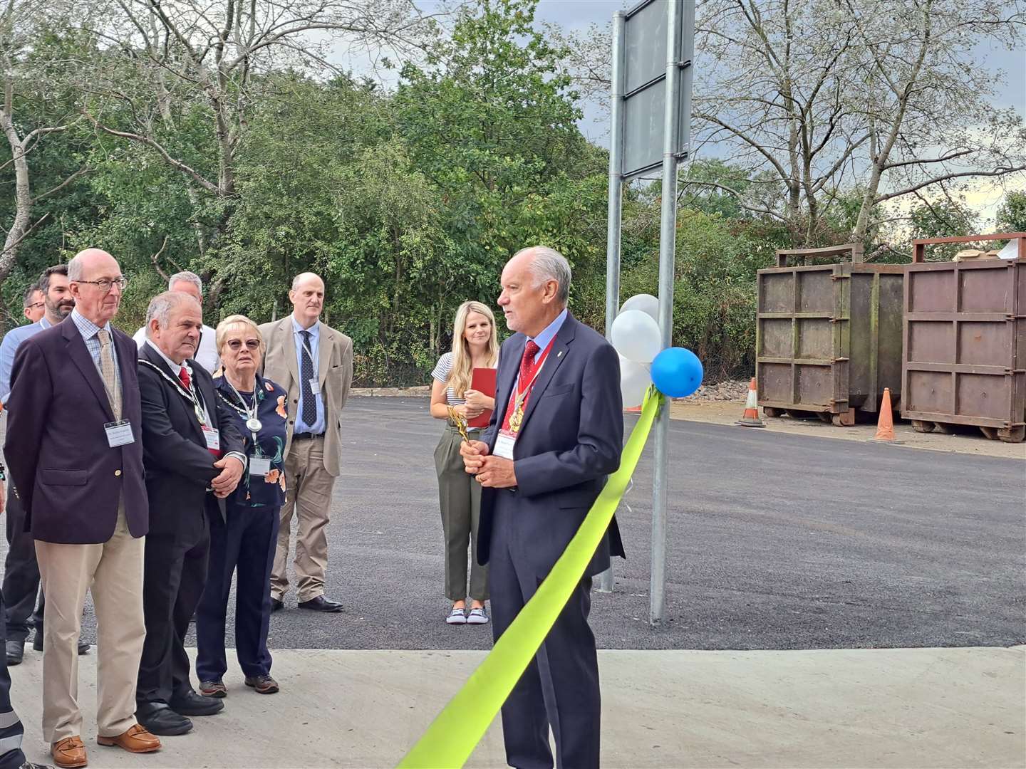 Cllr Brian Sweetland prepares to cut the tape to open the new Sevenoaks waste transfer station