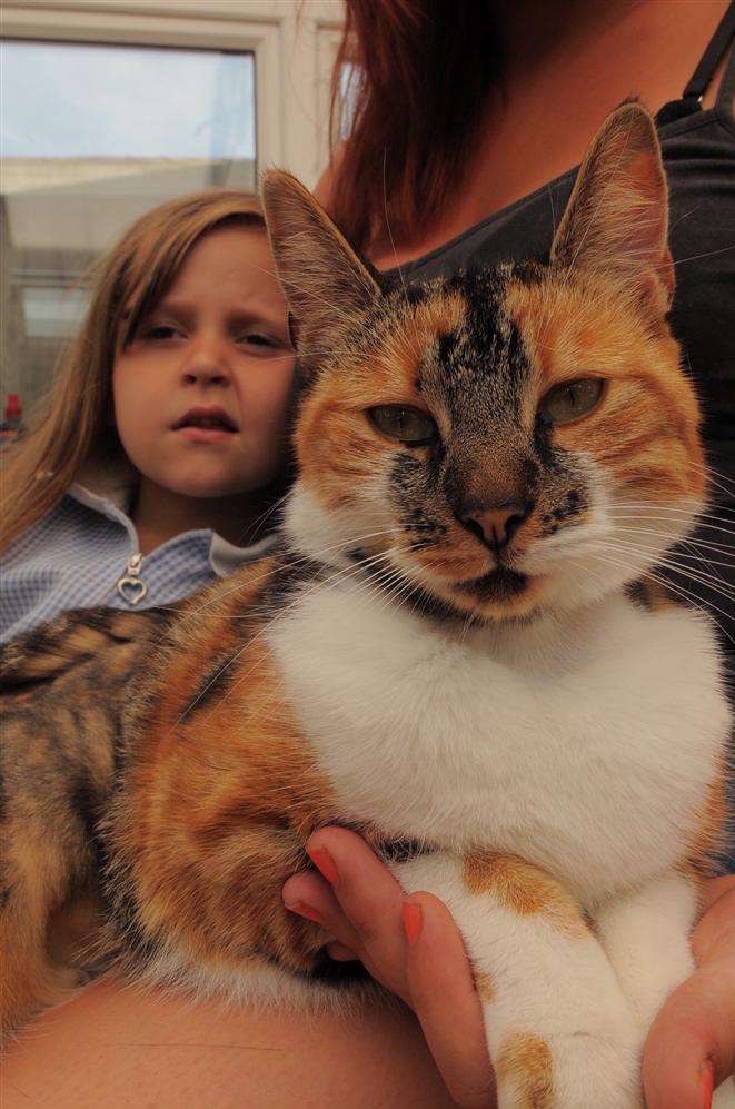 Roxanne Osborne and Biscuit the cat who was shot.