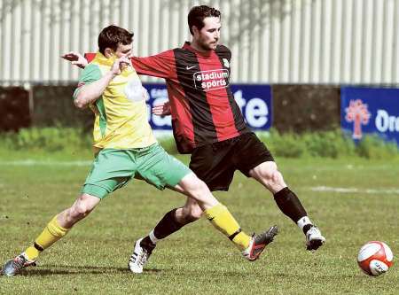 Sittingbourne captain Anthony Hogg stretches for the ball