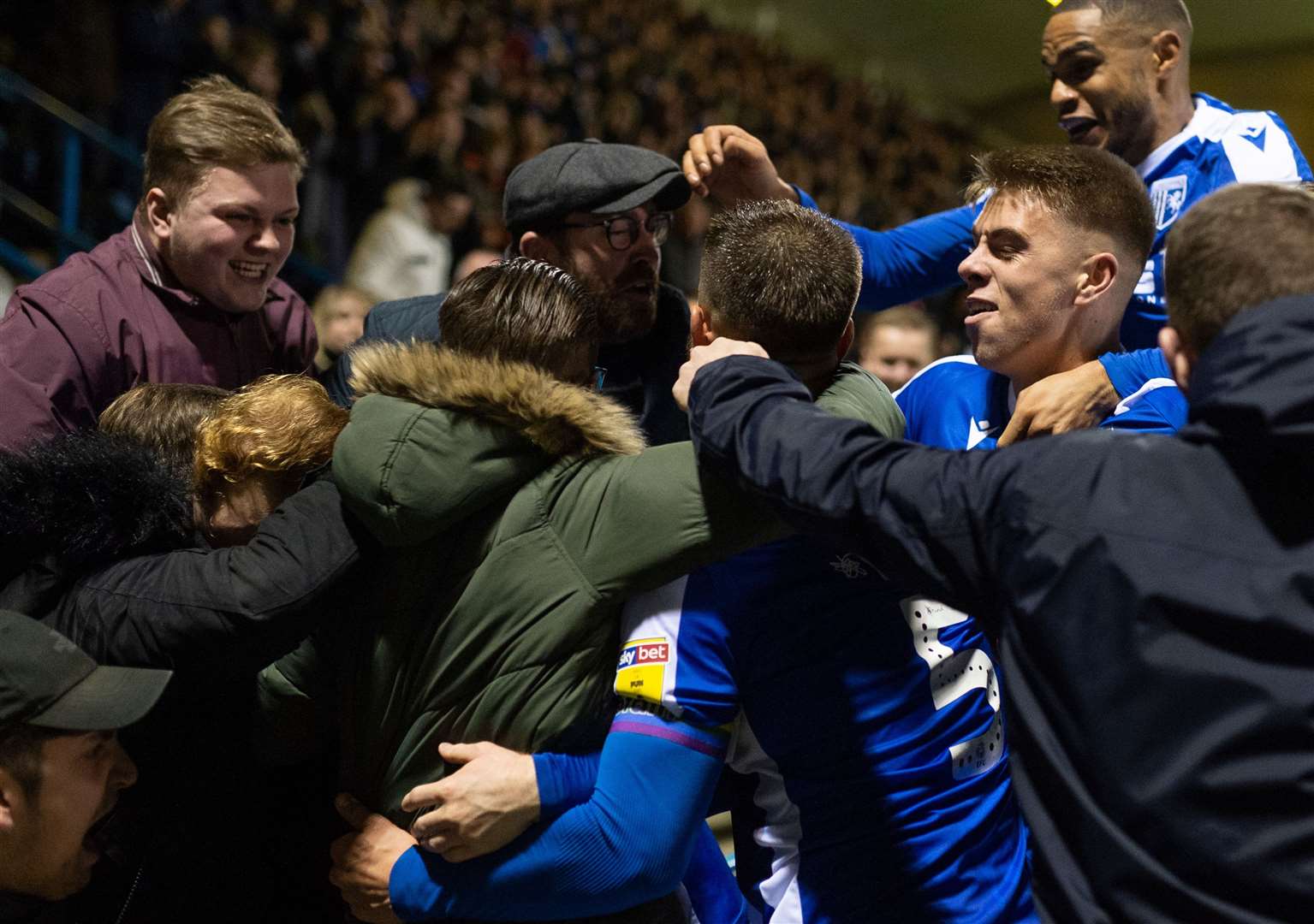 Connor Ogilvie is mobbed by fans and team-mates after scoring the winner against Sunderland Picture: Ady Kerry