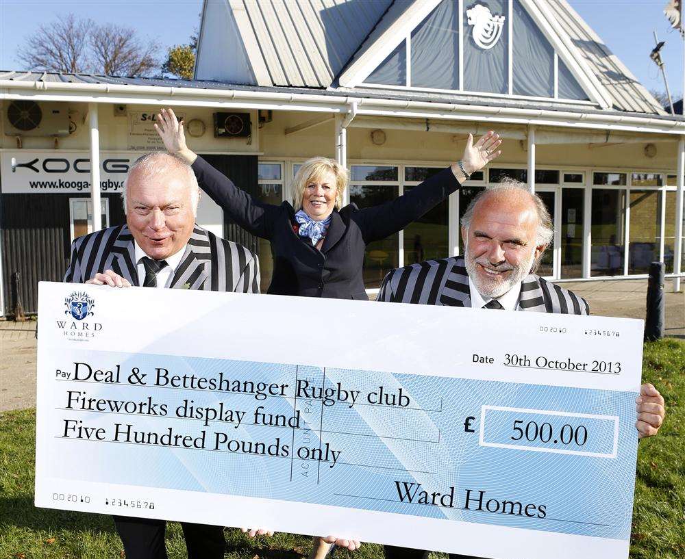 Help from Ward Homes for firework display. From left, Dave Rose the president Deal and Betteshanger Rugby Football Club, Sally Harley the sales advisor from Sholden Fields Ward Homes and Serge Orlov, director of events at the rugby club town