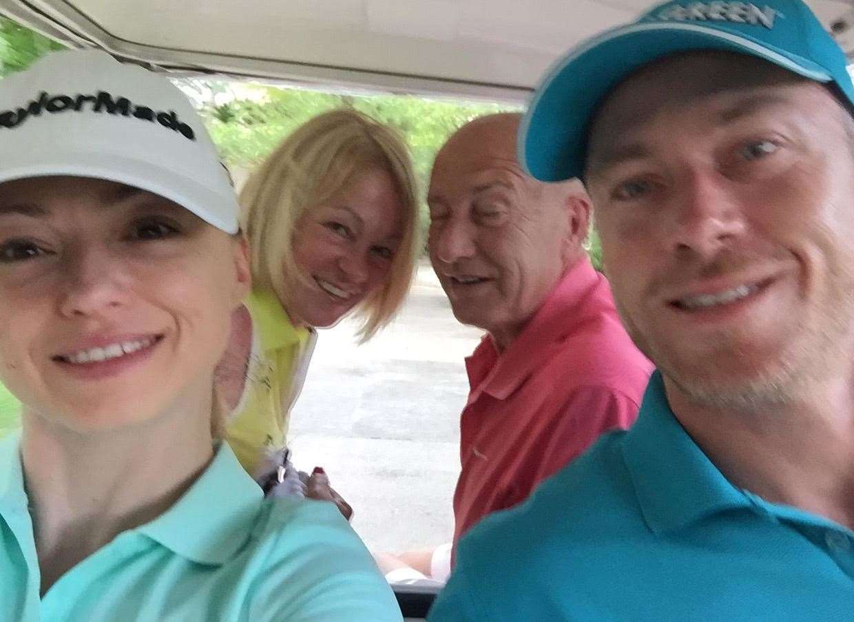 Ola and James Jordan sharing a golf buggy with James' parents Sharon and Allan