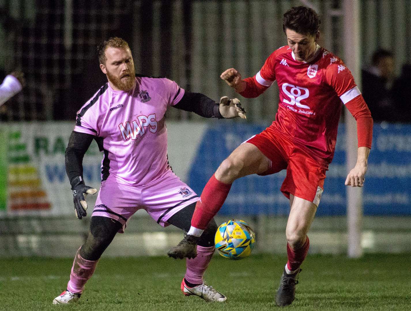 Deal goalkeeper Adam Molloy closes down Faversham player Billy Bennett. Picture: Paul Willmott