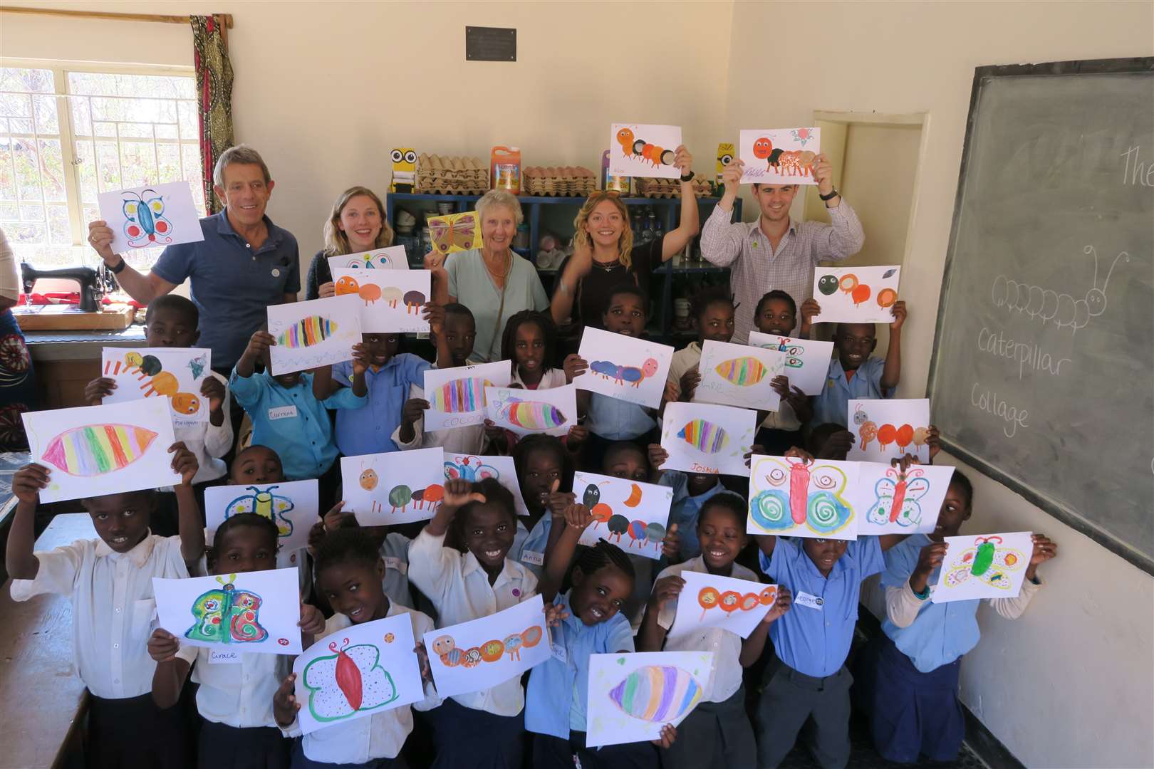 Charlie Metcalf, back, left, with his family at the Tongabezi Trust School, where classrooms have been dedicated to Gill